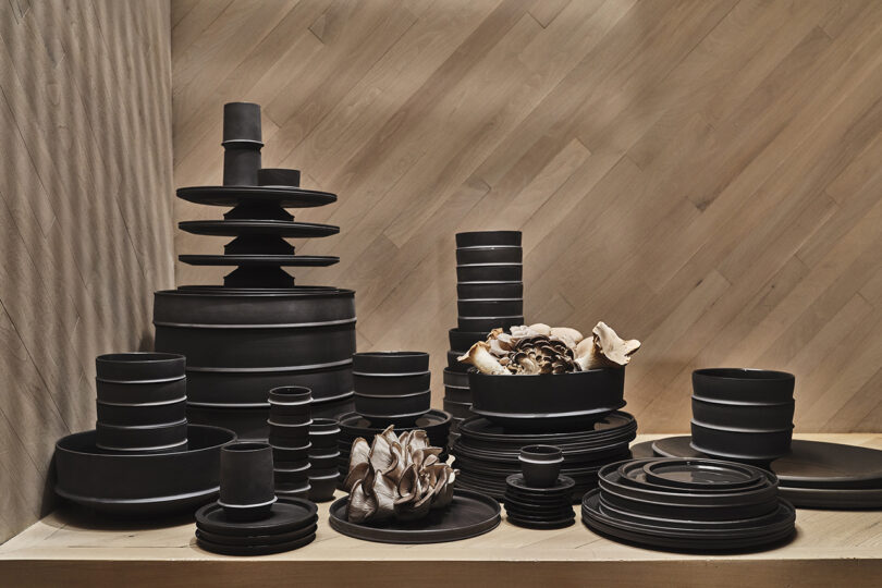 collection of stacked black tableware