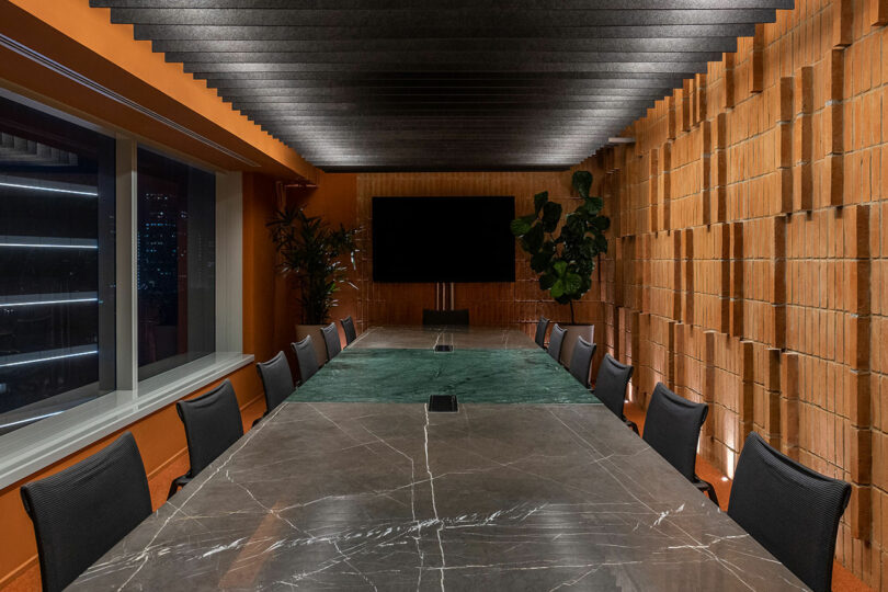 meeting room with terracotta brick wall