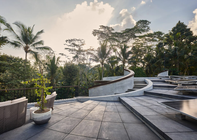 exterior view from top of modern spiral house in jungle
