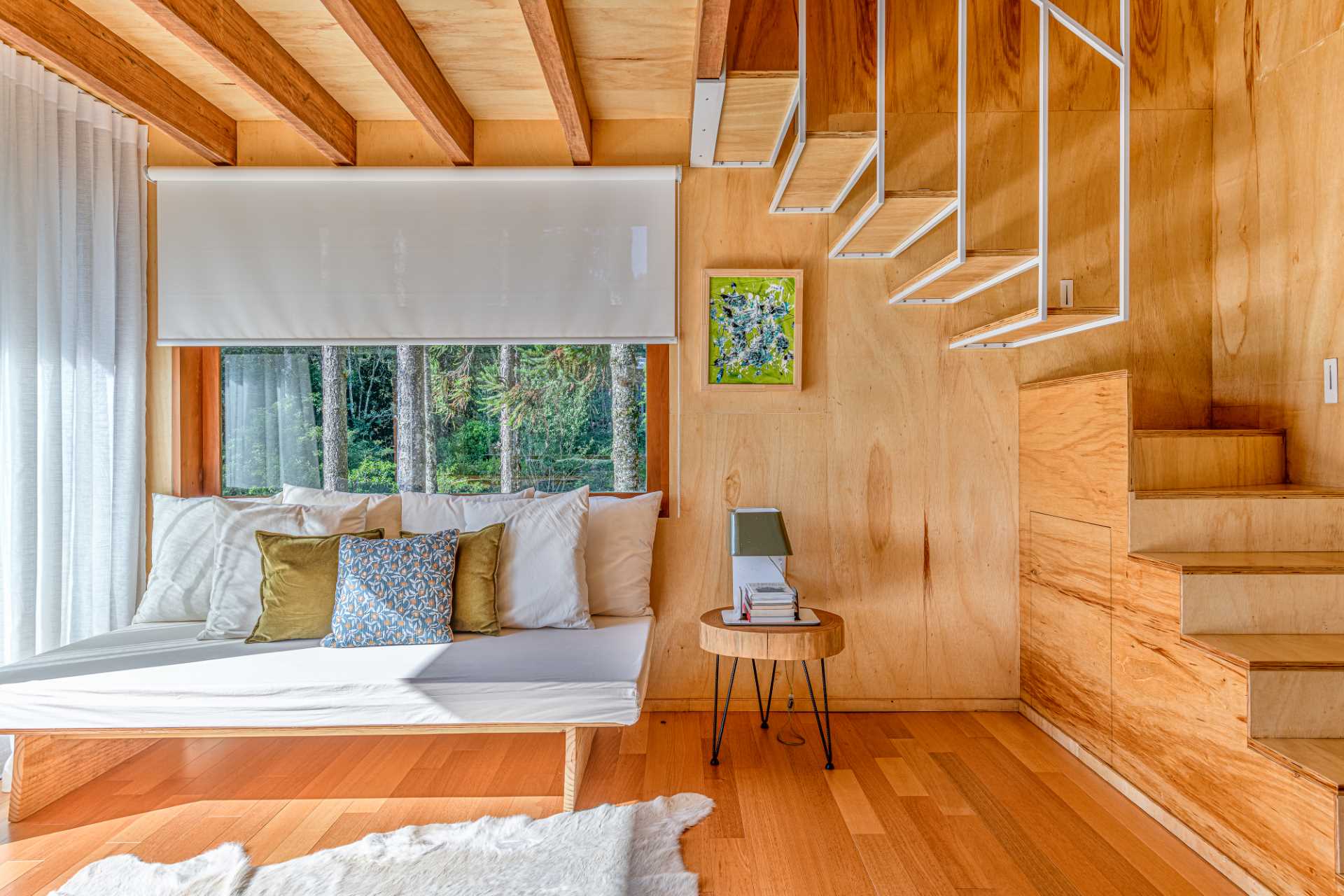 The living room of a small modern tree house in Brazil.