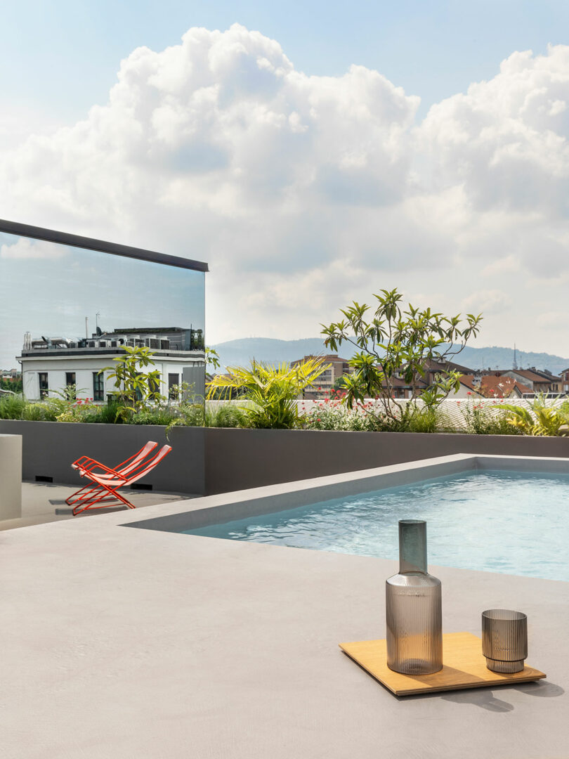 rooftop terrace with views of plants and pool