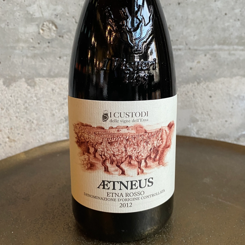 wine bottle with label reading Aetnus Etna Rossa