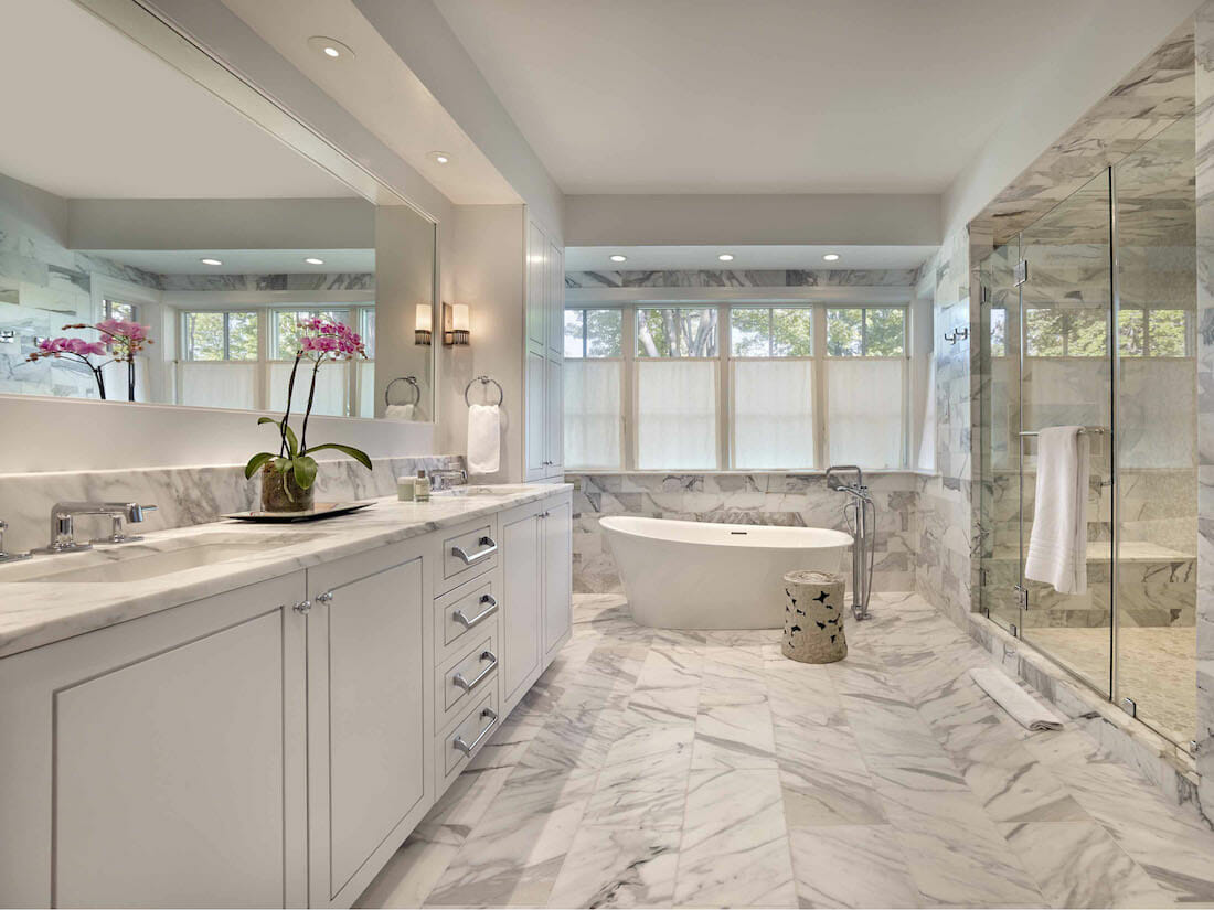 Modern bathroom design with a tub as a focal point by Decorilla designer Rachel H.
