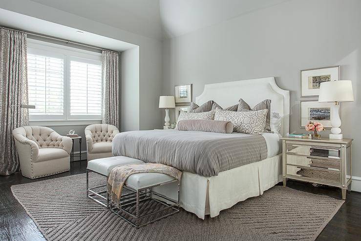 soft grey romantic master bedroom decor with two sitting chairs