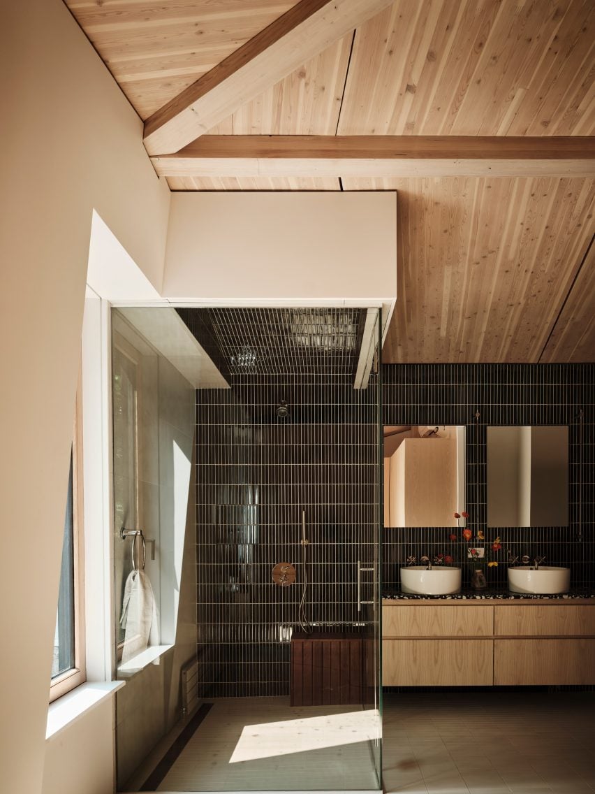 A bathroom with a glass shower and window ceilings
