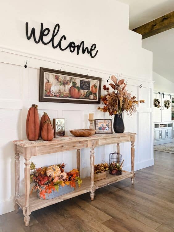Fall entry wall with console table and welcome sign.