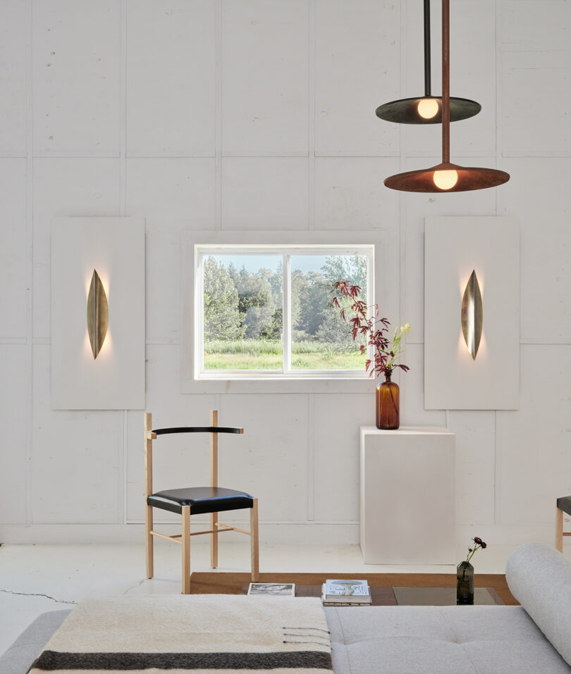 styled interior residential space with white walls and lots of abstract lighting