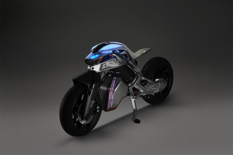 Front view of MOTOROiD 2 electric motorcycles blue LED illuminated ambient lighting from an angled side view.