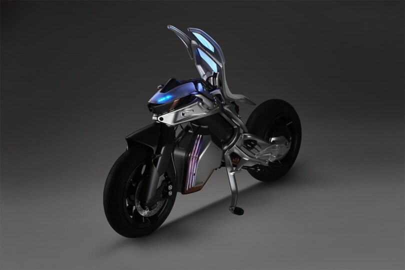Front view of MOTOROiD 2 electric motorcycles blue LED illuminated ambient lighting with top cover+seat tilted and opened into backward upright position.