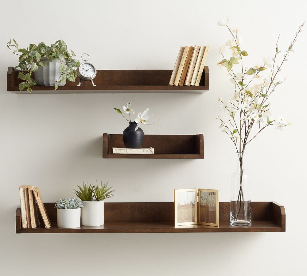 Floating shelves in an entryway.