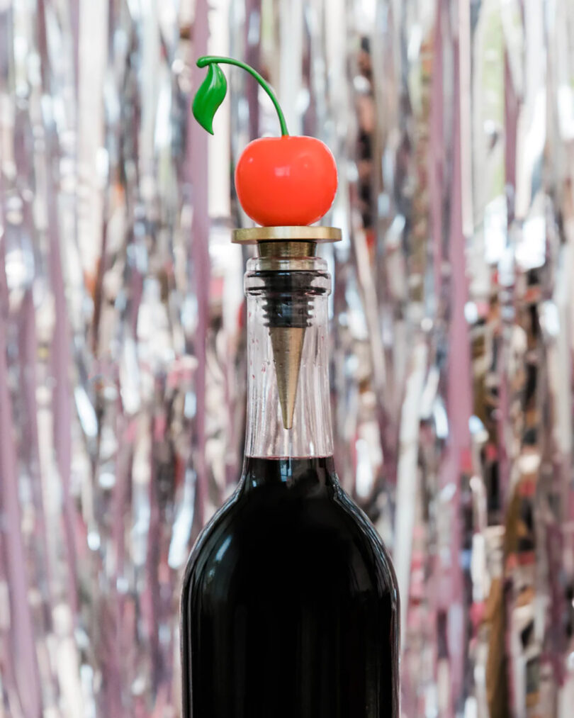 cherry-shaped bottle stopper in a bottle of wine