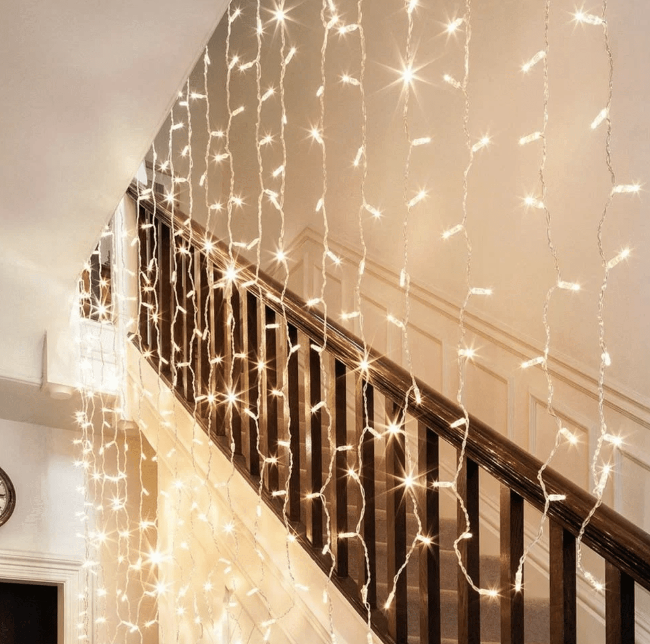 hanging string lights in stairway