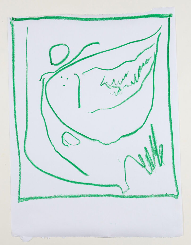child's drawing in green crayon on white paper