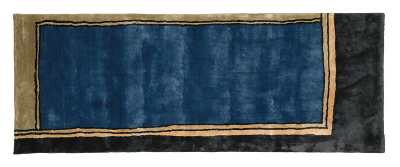 dark blue, black, and tan abstract rug on white background