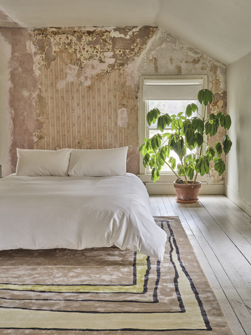 styled bedroom with rectangular tan, olive green, and cream rug