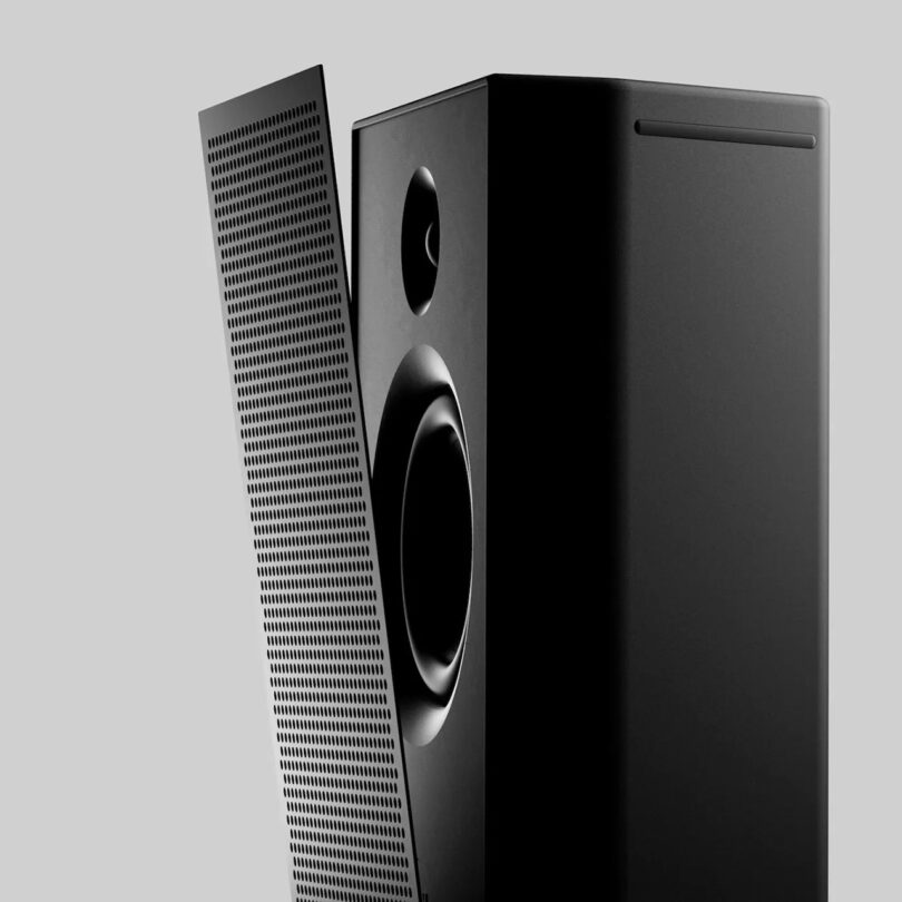 AIAIAI UNIT-4 from side with its front grill angled and slightly removed from main speaker.