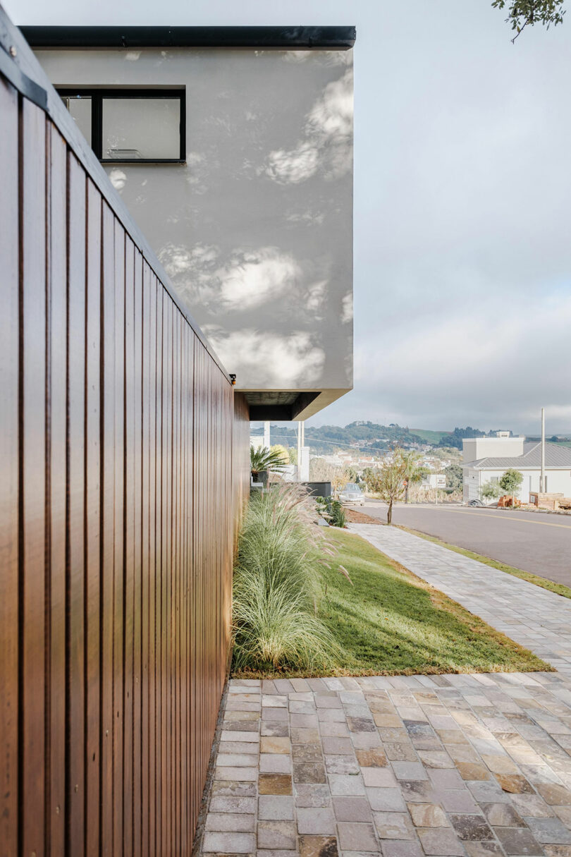 front long view of modern house with wood slatted fence