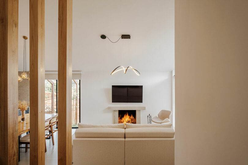 view through wood slat partition into modern living room