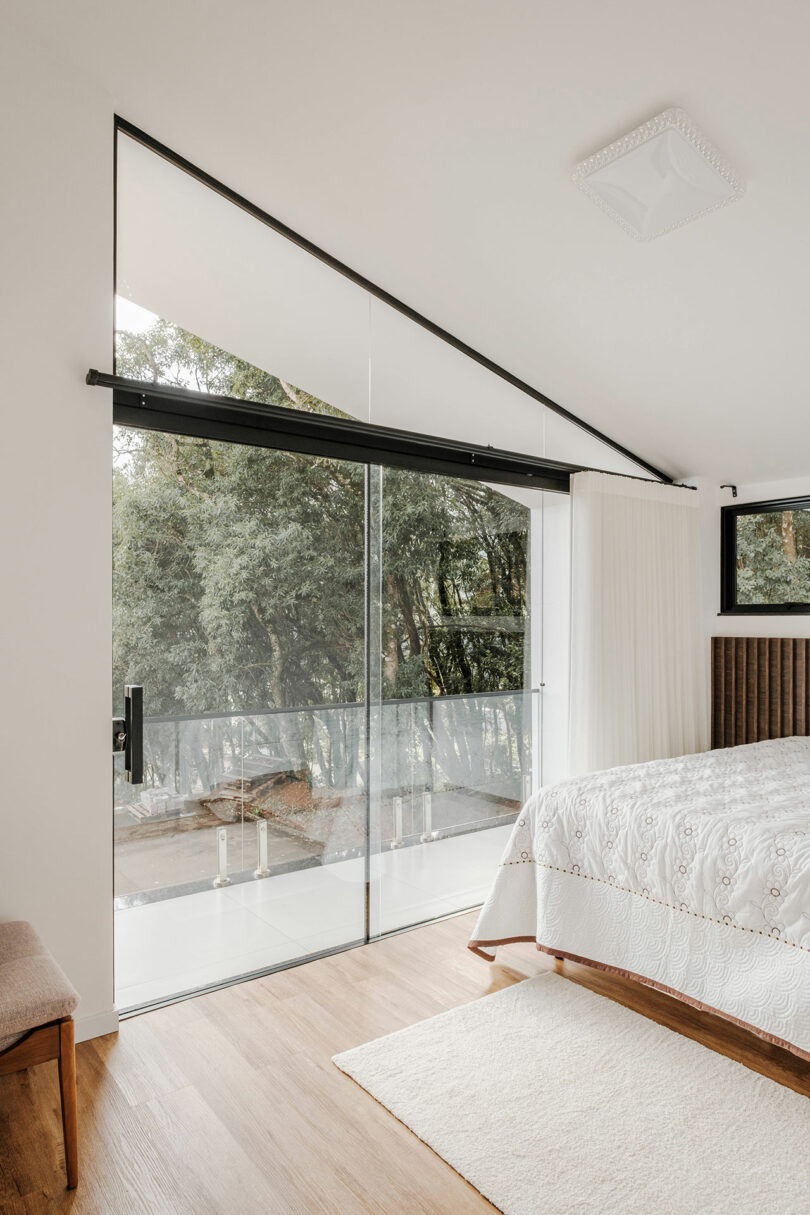 angled partial view of modern bedroom under angled ceiling