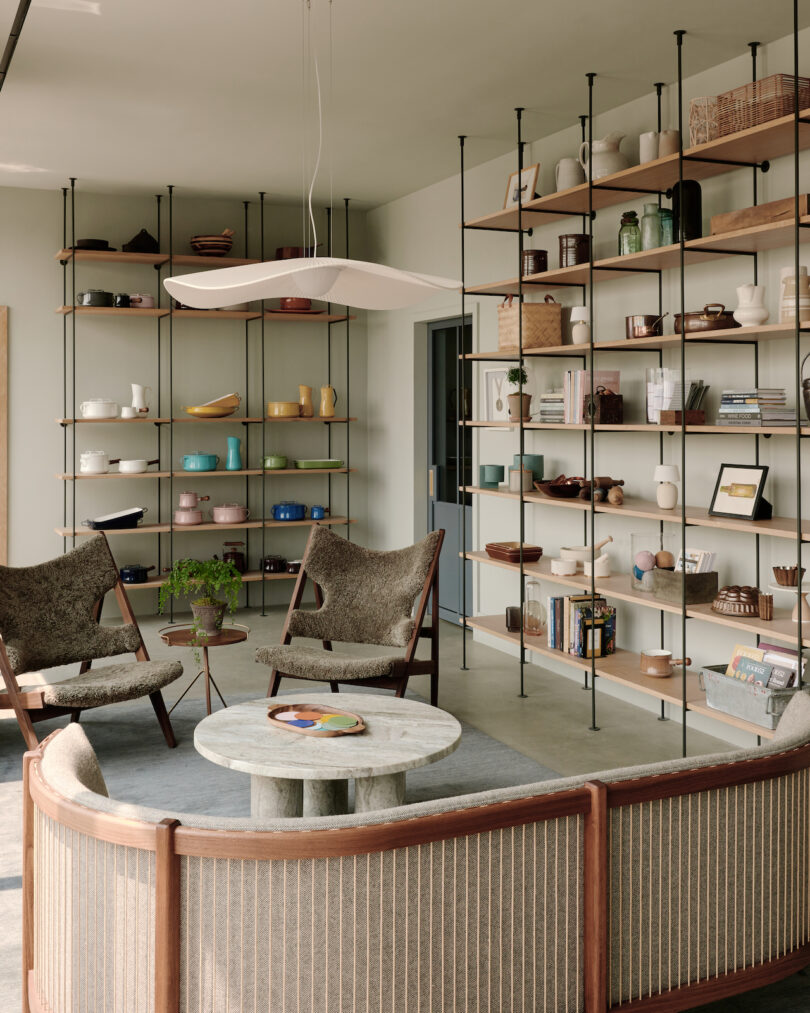 waiting room in office with open shelving and various seating