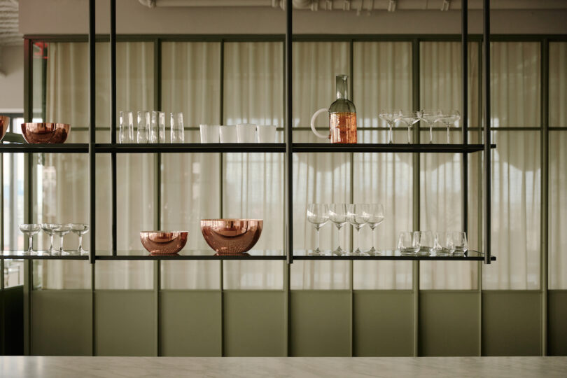 shelving with barware and drinking glasses on it