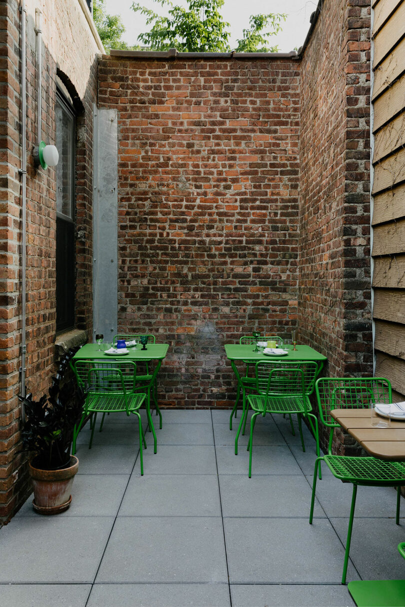 Outdoor seating with green furniture.