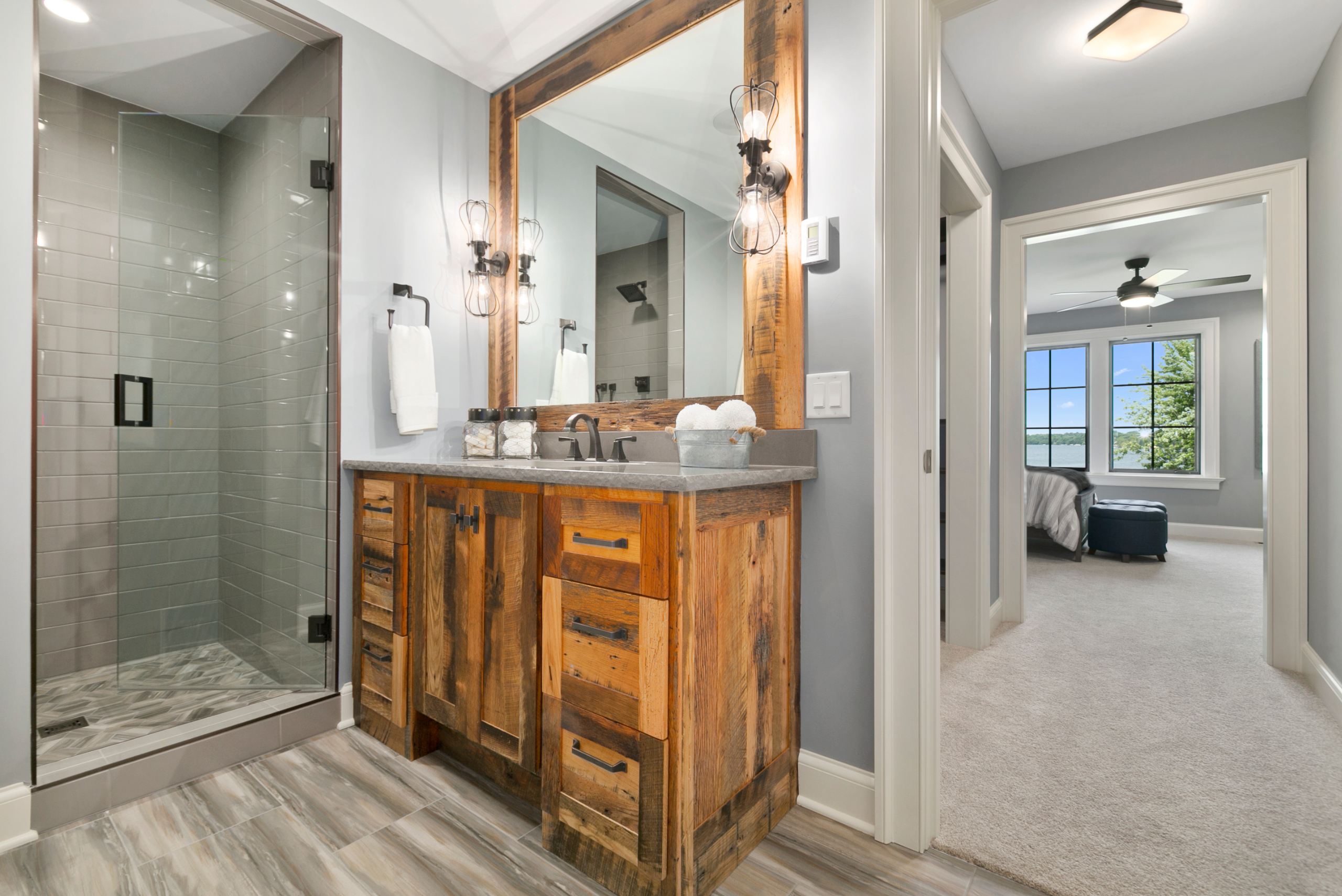 Modern bathroom with cohesive color and great lights.