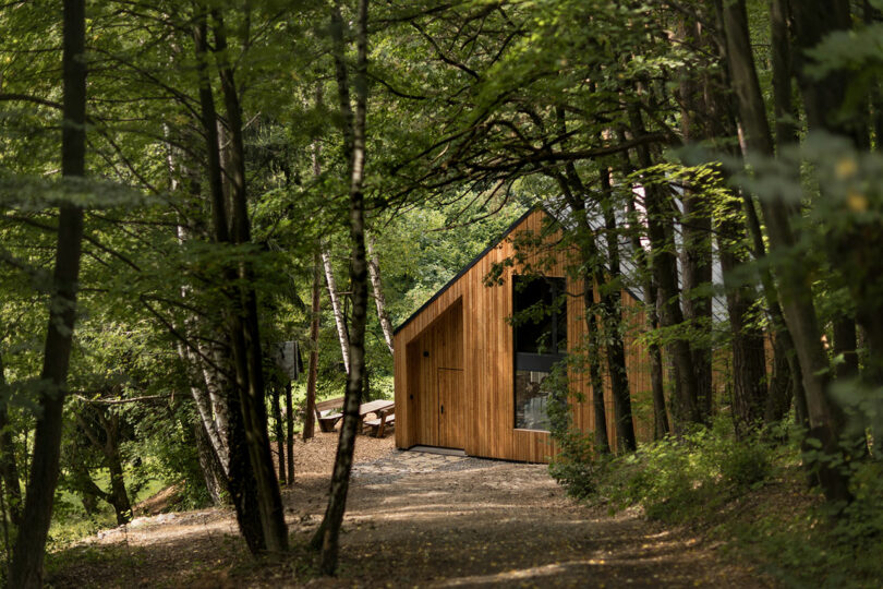 daytime shot of exterior of simple wood house