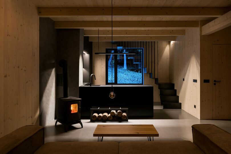 dark and moody interior shot of modern cabin with minimalist furnishings