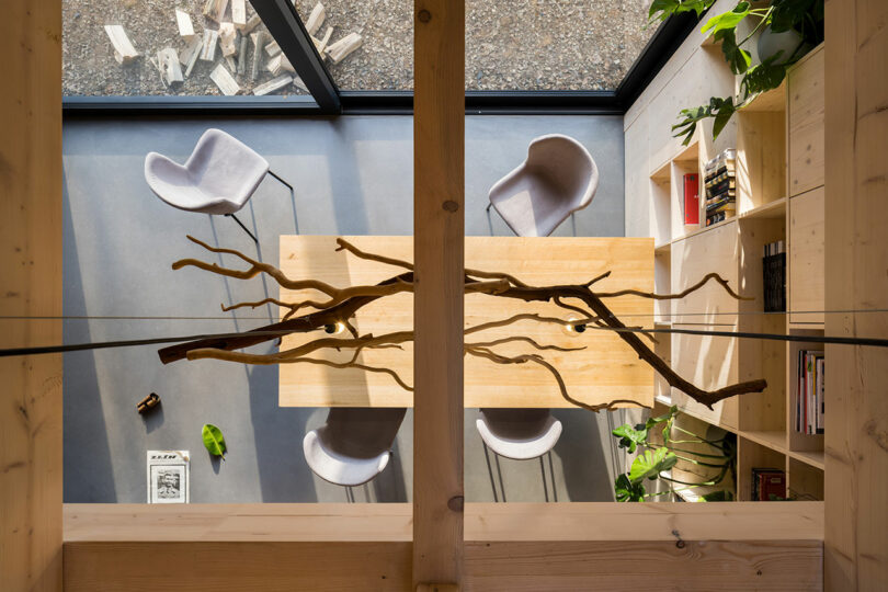 looking down from the second floor through to modern dining room below