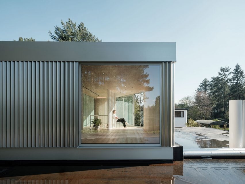 Steel-clad rooftop extension to a home by ISM Architecten