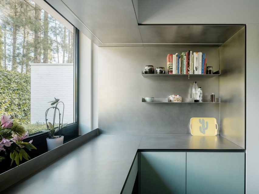 Steel and turquoise kitchen in a modernist home