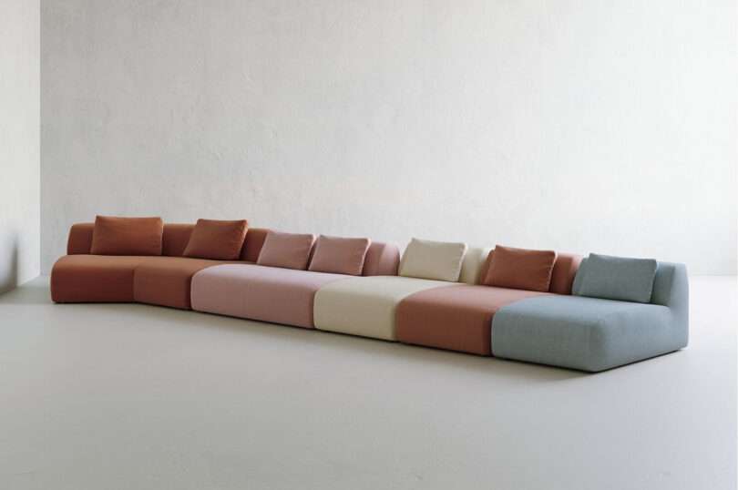 a rainbow of sectional sofa colors lined up in a row