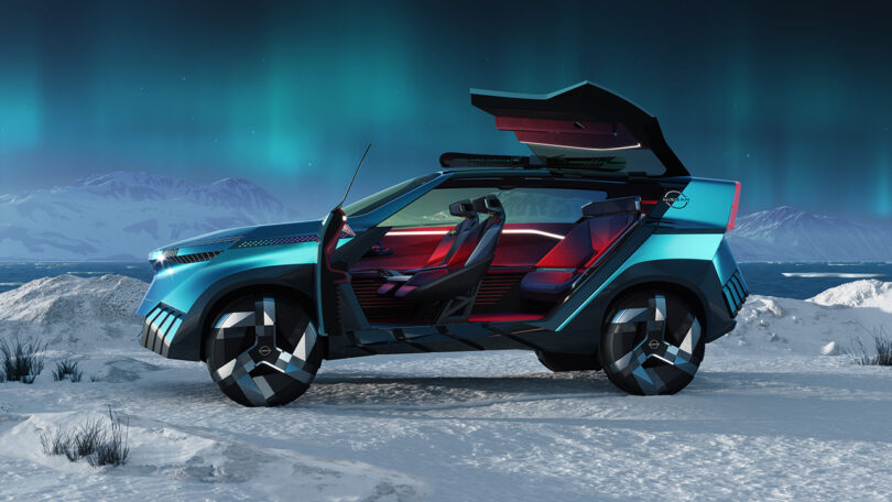 Sideview of the sharply paneled icy blue Nissan Hyper Adventure concept render set in a snowy setting with the Northern Lights glowing in the background with an Arctic body of water just a few feet away. Both front doors and gullwing rear doors are open fully, offering a peek inside a deep red illuminated interior with two front seats and one large bucket sofa-shaped rear.