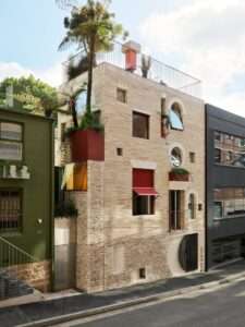 Reclaimed materials form "playful and textured" facade of Sydney house