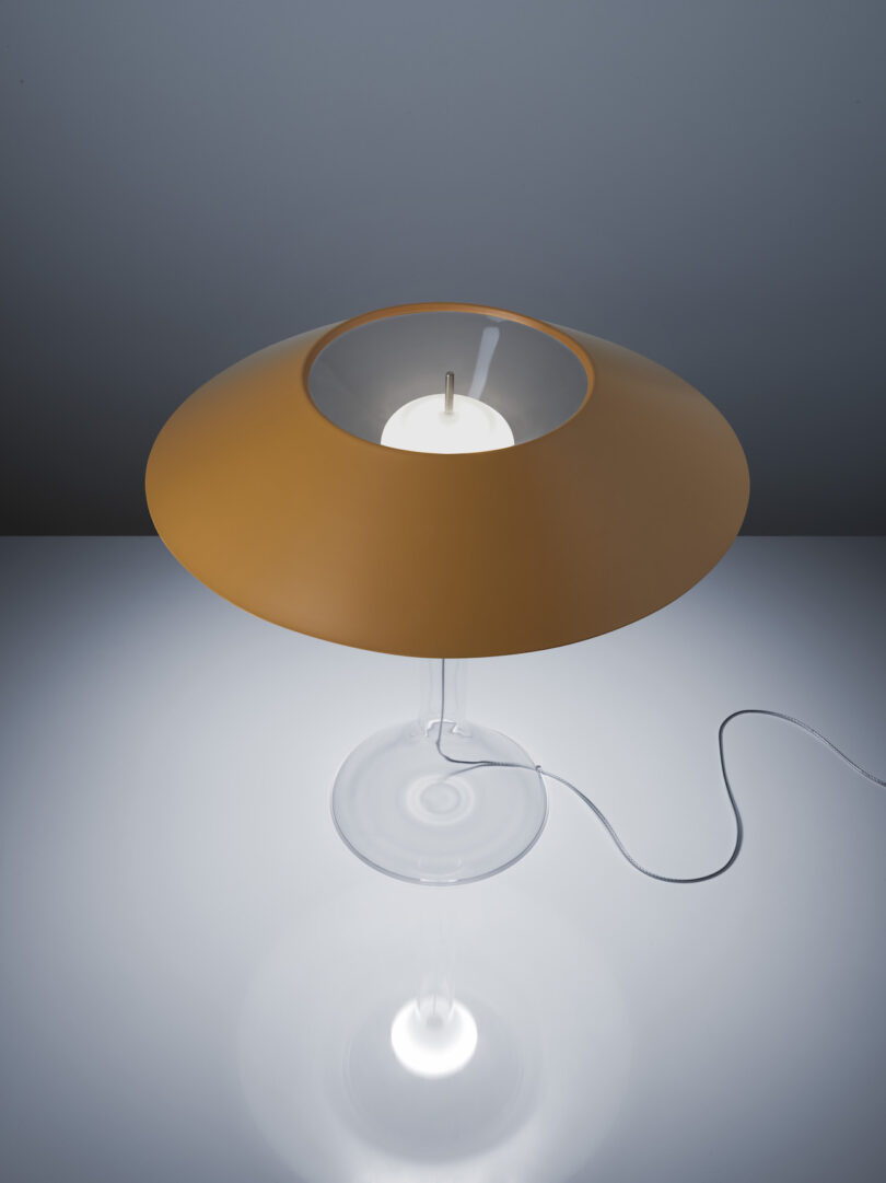 yellow metal lamp with transparent body