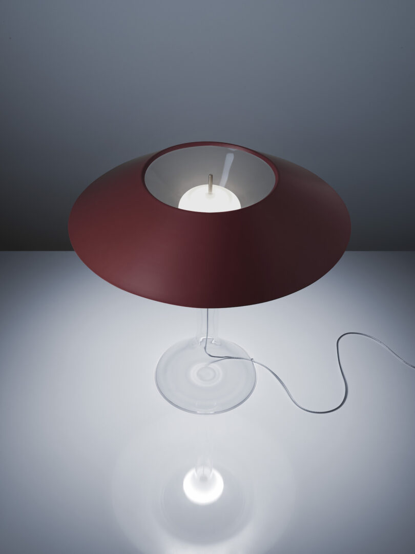 burgundy metal lamp with transparent body