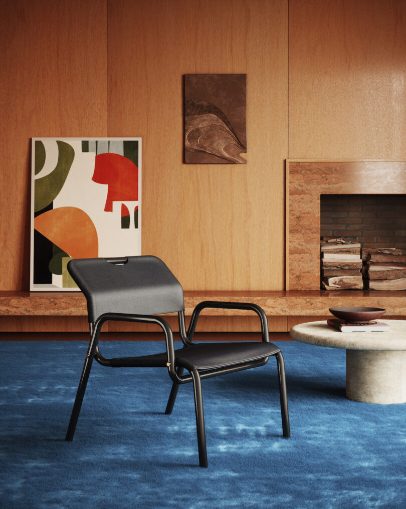 black leather lounge chair in room with blue carpet