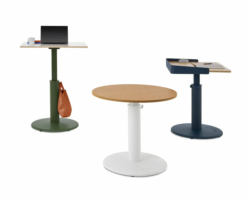 three height adjustable desks
