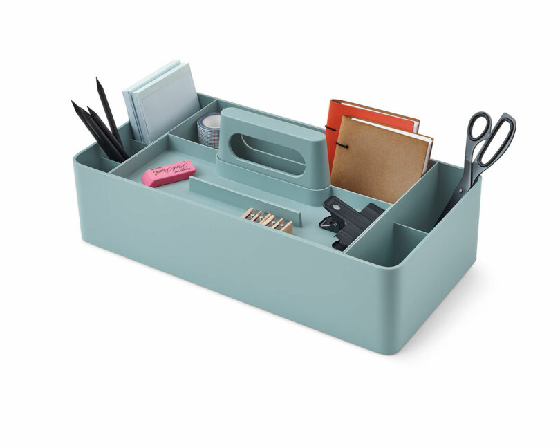 teal caddy filled with office supplies