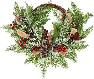 winter christmas wreath with pinecones red berries and ribbon
