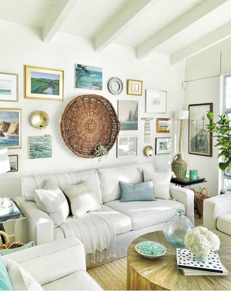 Living room gallery with a larger circular art piece and framed pictures.