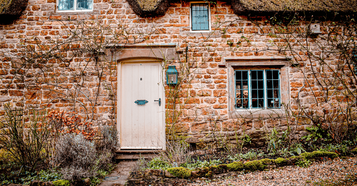 Exterior of a cottagecore house with pathways.