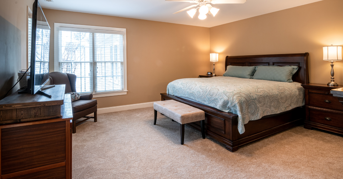 Bedroom with wall-to-wall carpet.