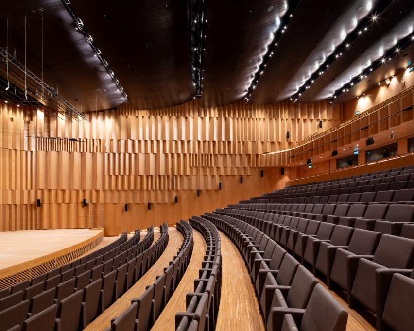 Timber-clad auditorium at the Polish History Museum by WXCA
