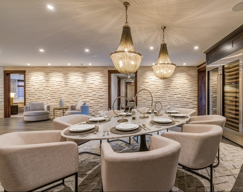 Transitional formal dining room with glam accents by Decorilla