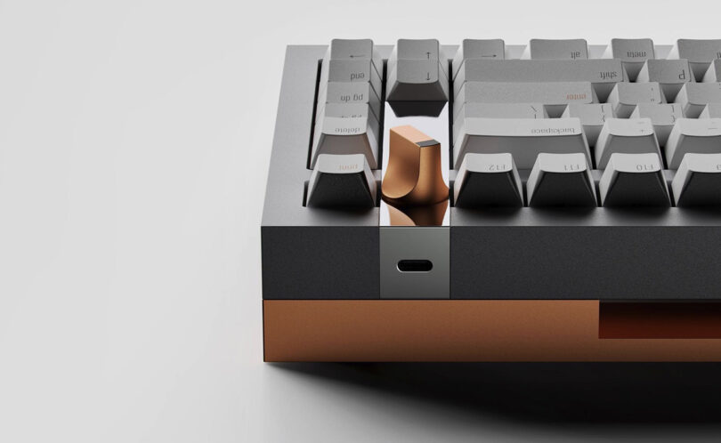 Close up rear view of geistmaschine mechanical keyboard showing the USB-C port and bronze detailing