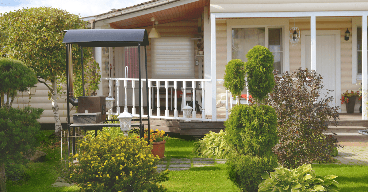 Bungalow house with white porch rails.