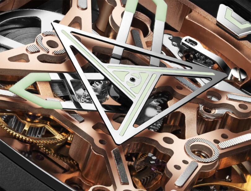 Detail of the mechanical gears and complications of the rose gold CIGA Design Eye of Horus mechanical wristwatch 
