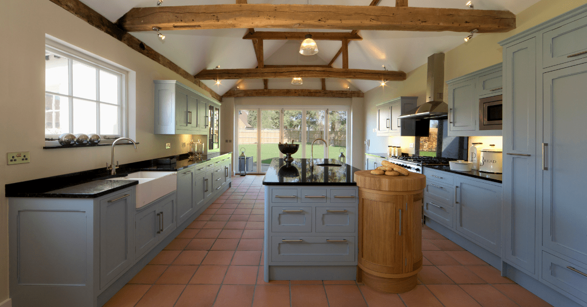 Kitchen with terracotta floor tiles.